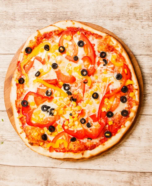 Pizza on the wood background — Stock Photo, Image