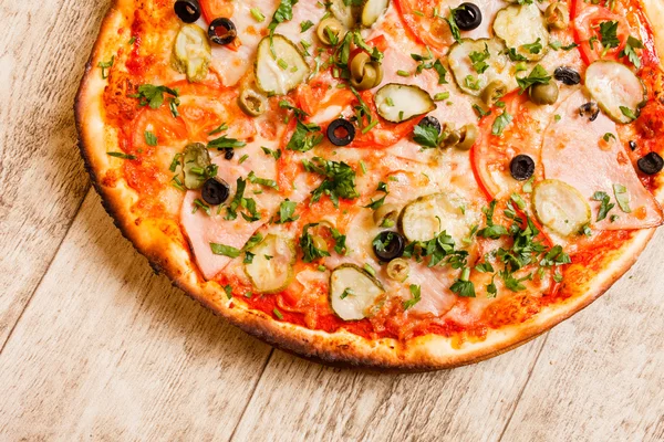 Pizza on the wood background — Stock Photo, Image