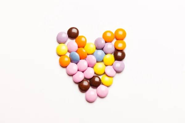 Heart made of multicolored candies — Stock Photo, Image