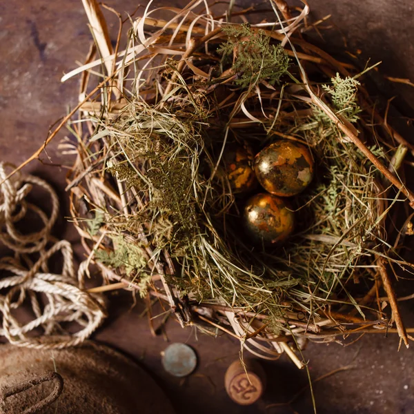 Golden eggs in the nest — Stock Photo, Image