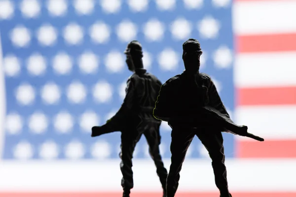 American soldiers on flag background — Stock Photo, Image