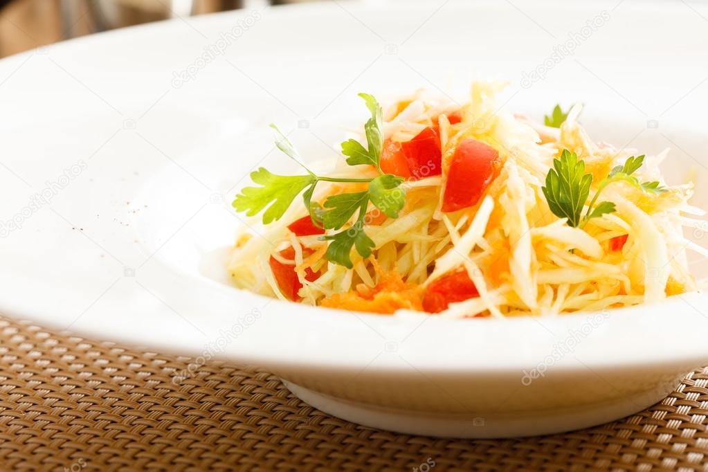 Healthy salad on white plate