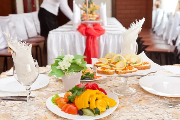 Table setting with food on dishes — Stock Photo, Image