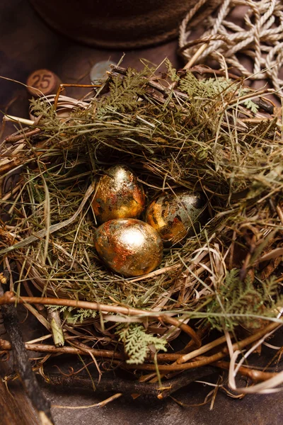 Golden eggs in the nest — Stock Photo, Image