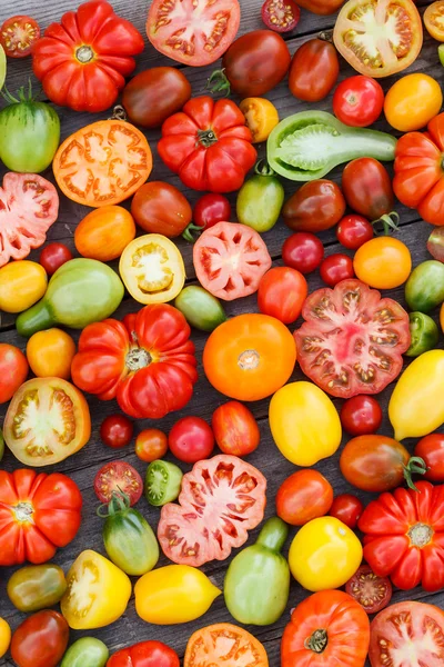 Colorful tomatoes background — Stock Photo, Image