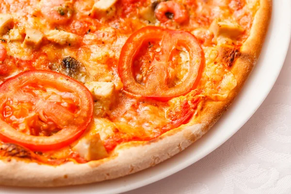 Tasty pizza on plate — Stock Photo, Image