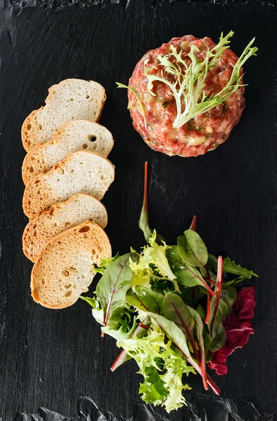 Beef tartar with greens — Stock Photo, Image