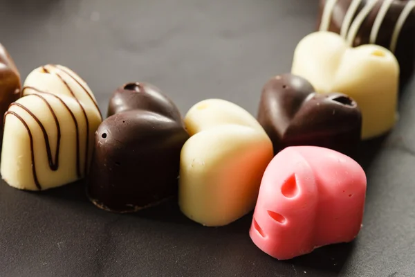Black and white chocolate hearts — Stock Photo, Image