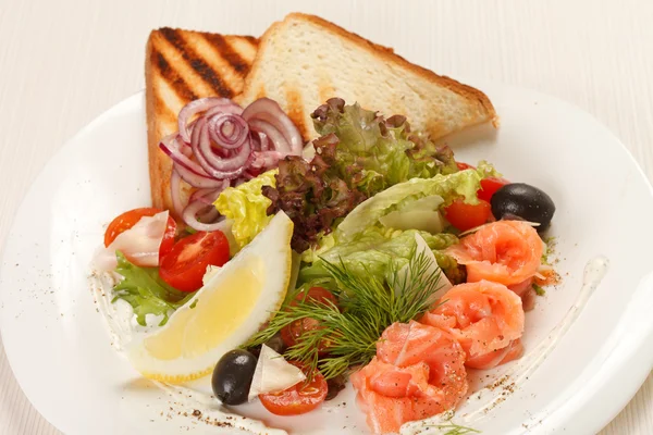 Appetizer with salmon and toasts — Stock Photo, Image