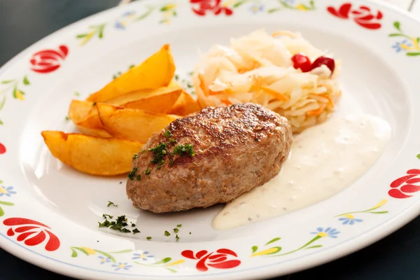 Cutlet with potatoes — Stock Photo, Image