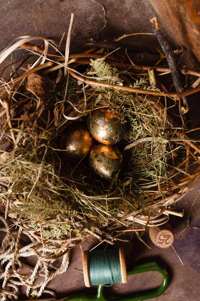Golden eggs in the nest — Stock Photo, Image