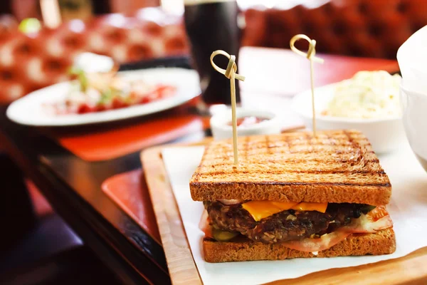 Sandwich with sauce in bar — Stock Photo, Image