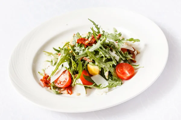 Salad with cherry tomatoes, cheese and herbs — Stock Photo, Image