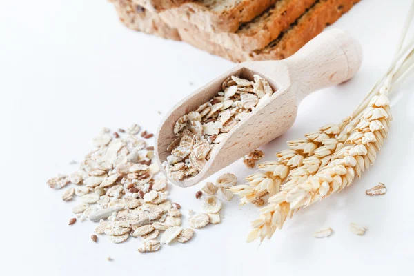 Sliced bread and grains — Stock Photo, Image