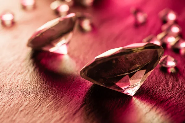 Different diamonds with red light — Stock Photo, Image