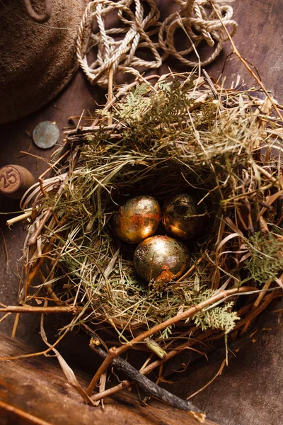 Golden eggs in the nest — Stock Photo, Image