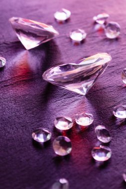 Different diamonds with purple light clipart