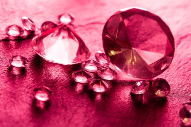 Different diamonds with red light clipart