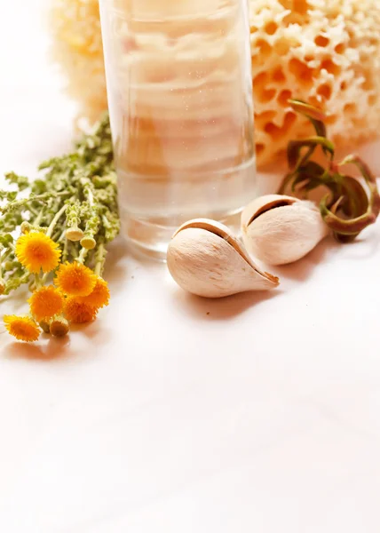 Herbal cosmetic with flowers — Stock Photo, Image