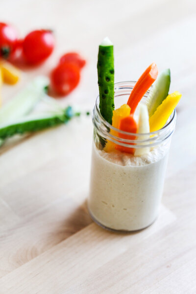 Hummus with vegetables in jar