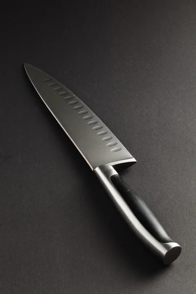 Kitchen knife on grey — Stock Photo, Image