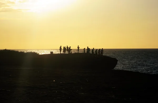 Silhouette of friends jumping — Stock Photo, Image