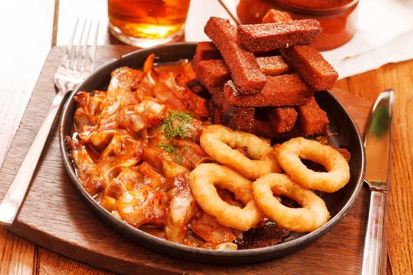 Appetizers in pan  at the pub — Stock Photo, Image