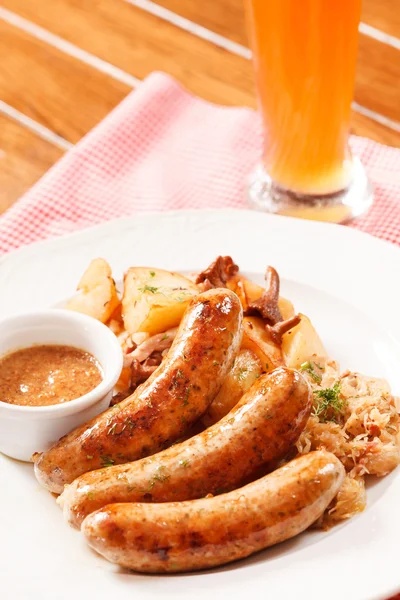 Sausages with cabbage and sauce — Stock Photo, Image