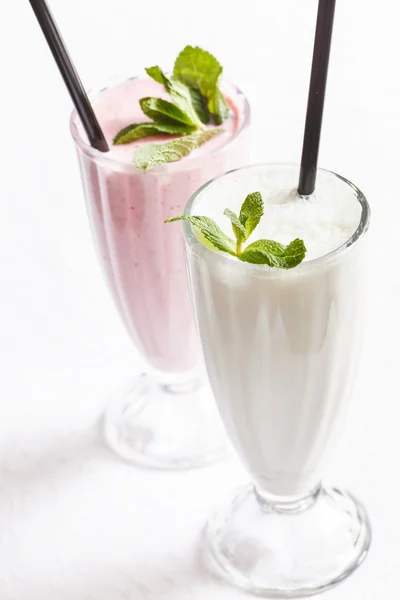Milk cocktails in glasses Royalty Free Stock Images