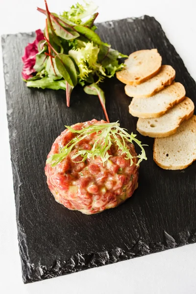 Beef tartar with greens — Stock Photo, Image