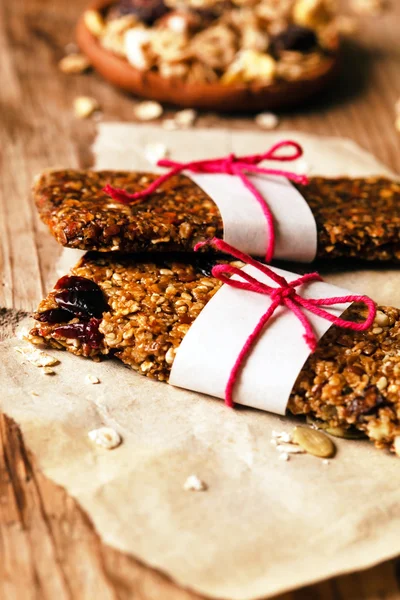 Granola bars on wooden table — Stock Photo, Image