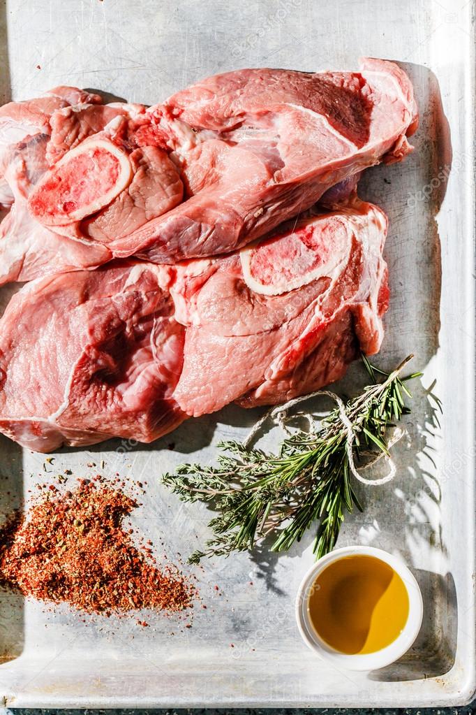 Raw meat with rosemary and olive oil