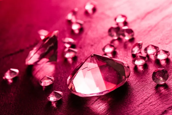 Different diamonds with red light — Stock Photo, Image