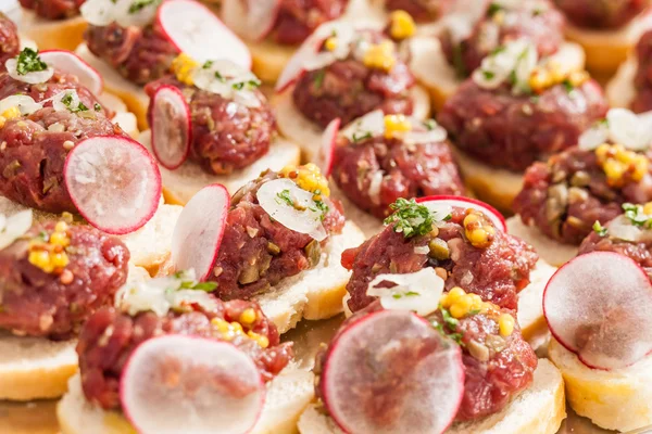 Tasty canapes with meat — Stock Photo, Image