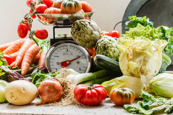 Fresh vegetables on scales — Stock Photo, Image