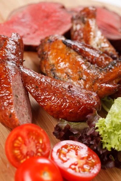 Sliced sausages on cutting board — Stock Photo, Image