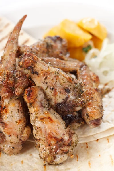 Chicken wings with pita bread — Stock Photo, Image