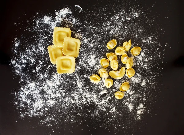 Italian ravioli and flour — Stock Photo, Image