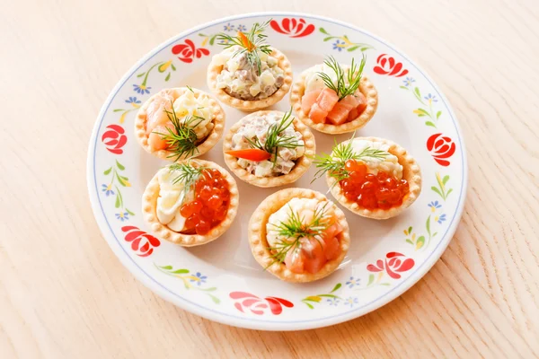Appetizer with salmon and caviar — Stock Photo, Image