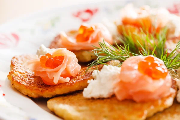 Potato pancakes with salmon — Stock Photo, Image