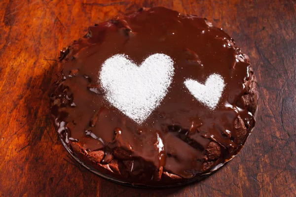 Chocolate cake with hearts — Stock Photo, Image