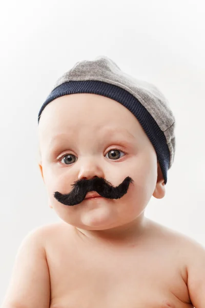 Söt baby med mustascher — Stockfoto