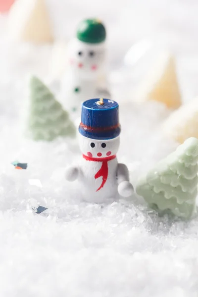 Christmas dolls in snow — Stock Photo, Image