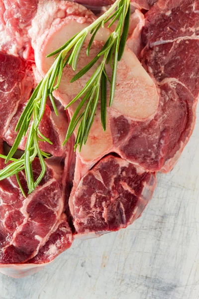 Raw steak with rosemary — Stock Photo, Image