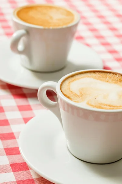 Cups of tasty cappuccino — Stock Photo, Image