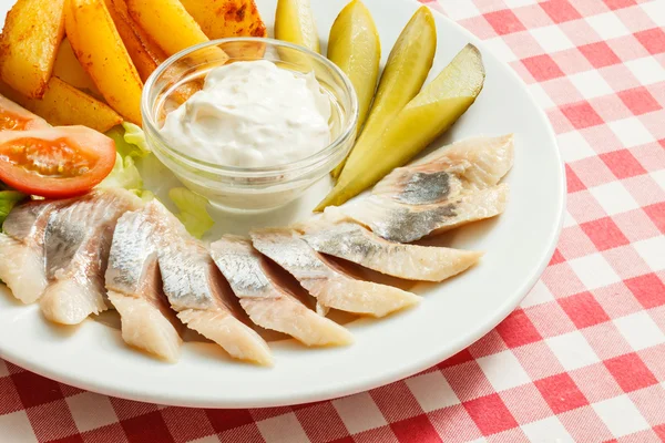Herring appetizer with potato and tomato — Stock Photo, Image