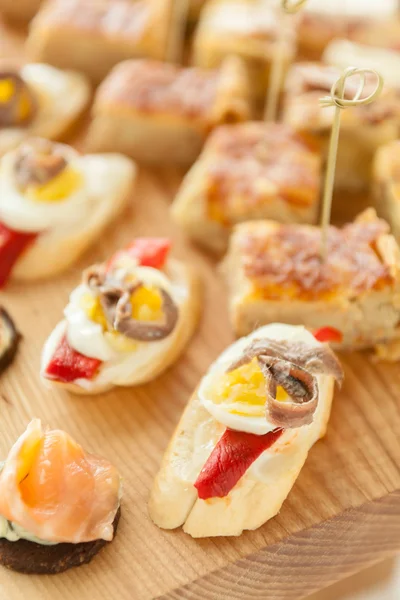 Canapes with fish and eggs — Stock Photo, Image