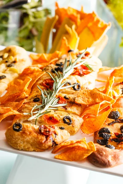 Italian snacks with bread and tacos — Stock Photo, Image