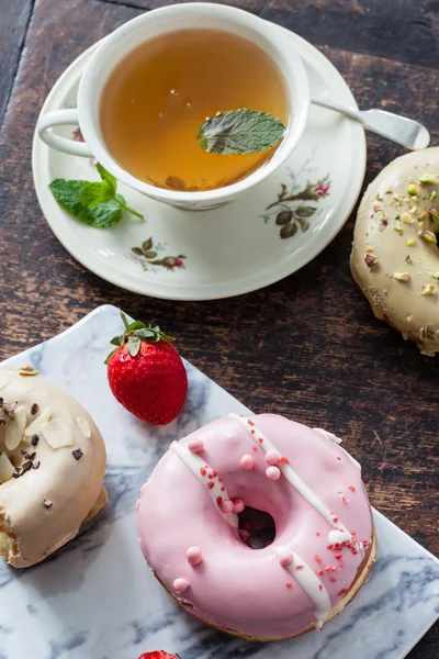Tasty donuts with tea — Stock Photo, Image