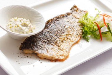 Baked carp with sauce